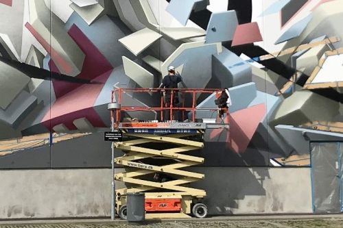 Mirko Reisser (DAIM) | ''DAIM - coming out Næstved'' | Spraypaint and facade paint on concrete wall | 760 x 4100 cm / 299.21 x 1614.17 inch (Hight incl socket: 9 m.) | Næstved / Denmark | 2018 | © Mirko Reisser (DAIM) | Courtesy: NÆSTVED KUNSTBY | Photo: Claus Pedersen